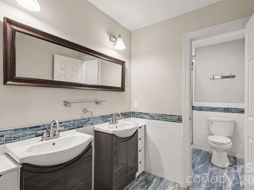 13520 Andulusian Drive, Matthews, NC 28105.  MLS# CAR4409742, YatesRealty ID 41651. Bathroom 2 also has dual vanities and has been beautifully updated.