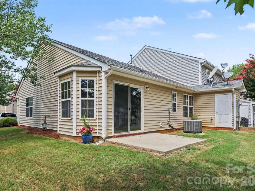 6124 Warrior Avenue, Fort Mill, SC 29707.  MLS# CAR4397314, YatesRealty ID 41666. Back of End Unit House