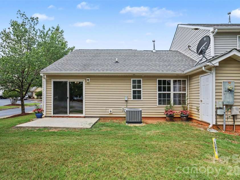 6124 Warrior Avenue, Fort Mill, SC 29707.  MLS# CAR4397314, YatesRealty ID 41666. Back of End Unit House