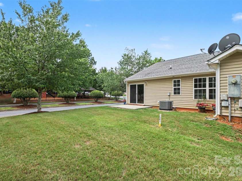 6124 Warrior Avenue, Fort Mill, SC 29707.  MLS# CAR4397314, YatesRealty ID 41666. Back View of End Unit House