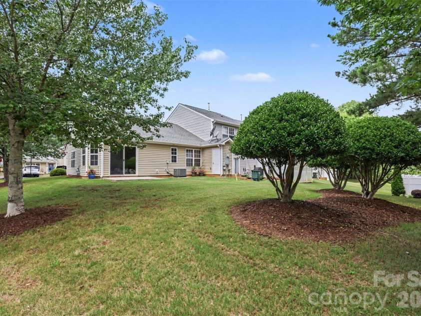 6124 Warrior Avenue, Fort Mill, SC 29707.  MLS# CAR4397314, YatesRealty ID 41666. Back View of End Unit House