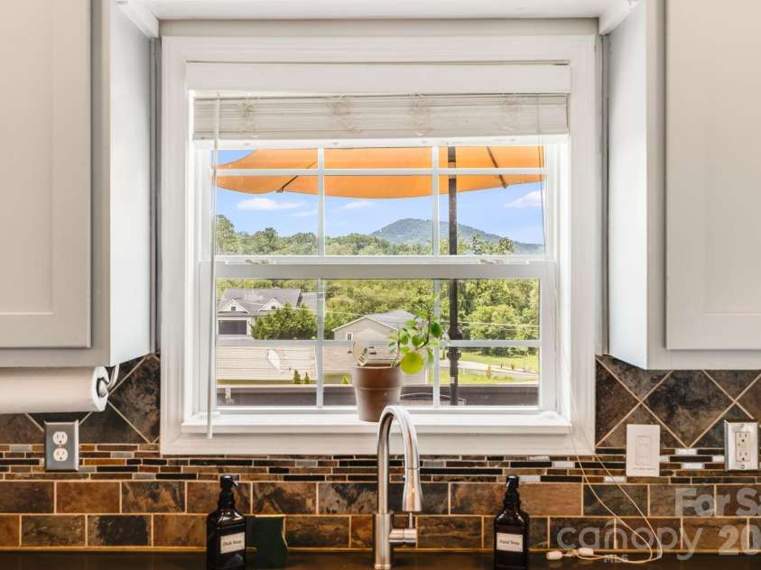 21 Old Pinner Place, Arden, NC 28704.  MLS# CAR4407827, YatesRealty ID 41672. Enjoy the view from the kitchen
