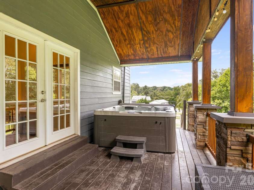 21 Old Pinner Place, Arden, NC 28704.  MLS# CAR4407827, YatesRealty ID 41672. Hot tub on side deck