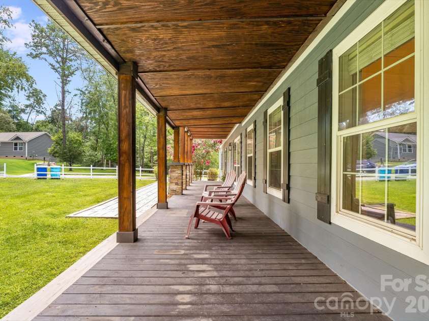 21 Old Pinner Place, Arden, NC 28704.  MLS# CAR4407827, YatesRealty ID 41672. Wrap around porch