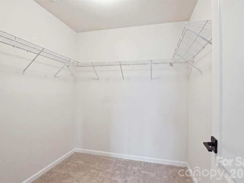2614 Winter Thistle Way, Fort Mill, SC 29707.  MLS# CAR4410501, YatesRealty ID 41675. Primary BedroomWalk-in Closet