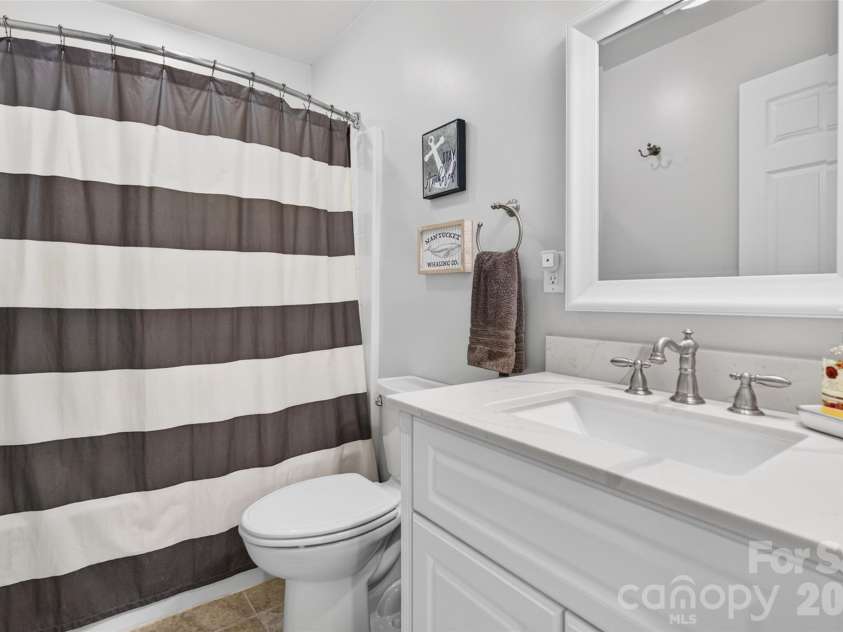 142 Talley Ridge Drive, Troutman, NC 28166.  MLS# CAR4407328, YatesRealty ID 41676. Lower Level Bath