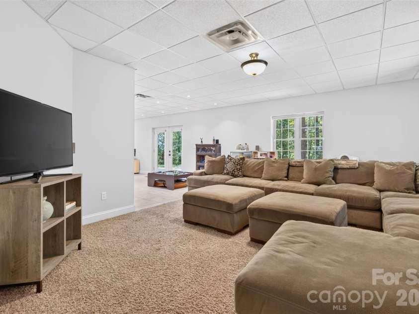 142 Talley Ridge Drive, Troutman, NC 28166.  MLS# CAR4407328, YatesRealty ID 41676. Lower Level great room