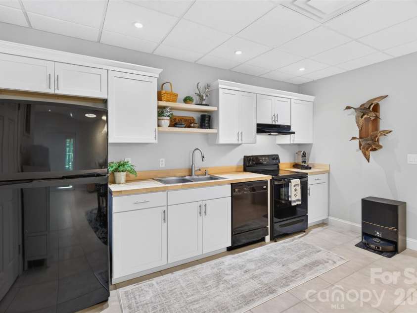 142 Talley Ridge Drive, Troutman, NC 28166.  MLS# CAR4407328, YatesRealty ID 41676. Lower Level kitchen
