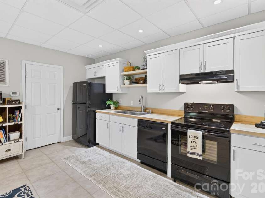 142 Talley Ridge Drive, Troutman, NC 28166.  MLS# CAR4407328, YatesRealty ID 41676. Lower Level Kitchen