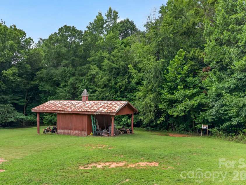 142 Talley Ridge Drive, Troutman, NC 28166.  MLS# CAR4407328, YatesRealty ID 41676. Tractor Shed for additional equipment storage