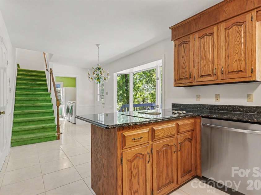 5301 Morrowick Road, Charlotte, NC 28226.  MLS# CAR4408633, YatesRealty ID 41681. Second staircase off of the kitchen
