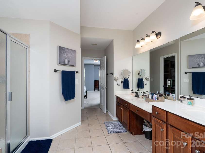 14117 Hiawatha Court, Huntersville, NC 28078.  MLS# CAR4235904, YatesRealty ID 4169. Primary bath with shower, soaking tub, 2 vanities and his and hers closets