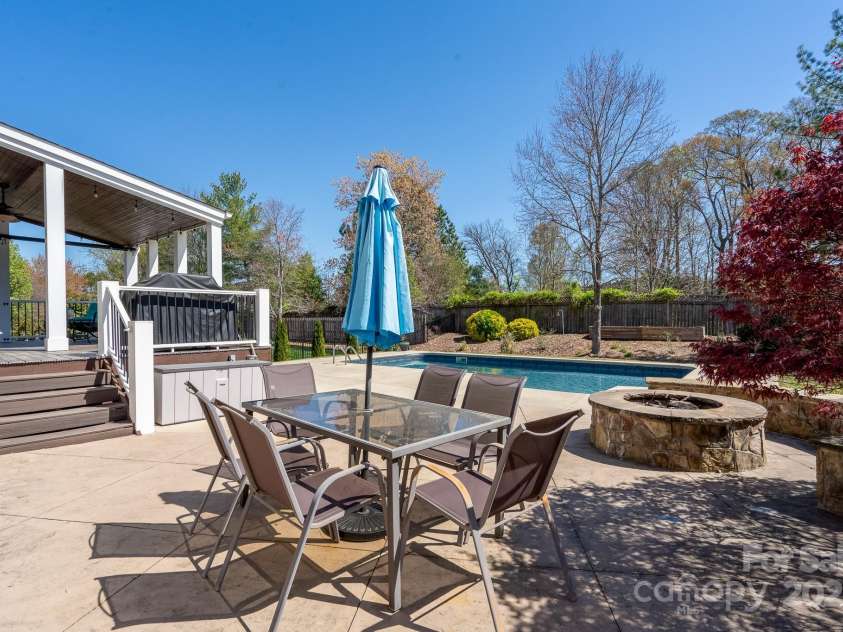 14117 Hiawatha Court, Huntersville, NC 28078.  MLS# CAR4235904, YatesRealty ID 4169. Relax with your firepit, outside dining area and fenced yard