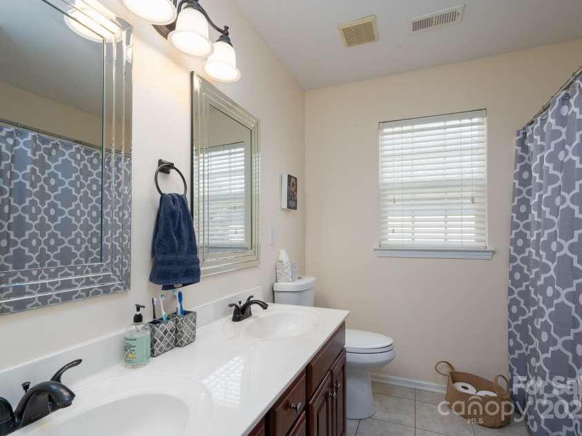 14117 Hiawatha Court, Huntersville, NC 28078.  MLS# CAR4235904, YatesRealty ID 4169. Upper full bath with dual vanites