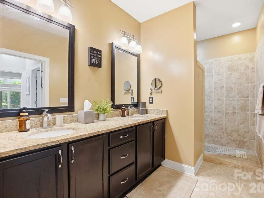 1100 Avalon Place, Matthews, NC 28104.  MLS# CAR4411415, YatesRealty ID 41696. Double vanity and walk in shower