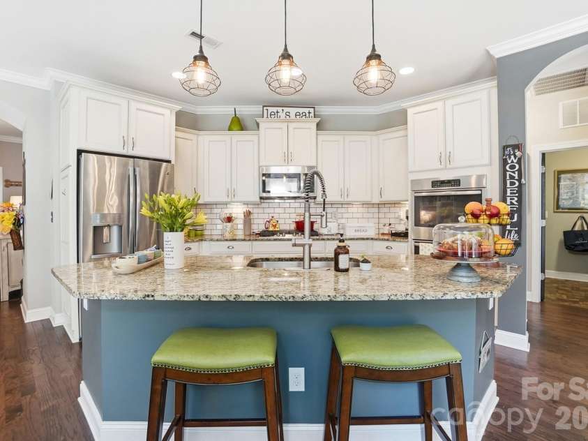 1100 Avalon Place, Matthews, NC 28104.  MLS# CAR4411415, YatesRealty ID 41696. Stunning white kitchen with island