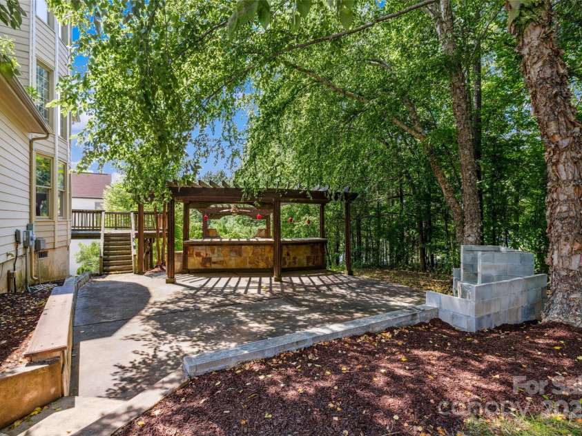 9142 Drayton Lane, Indian Land, SC 29707.  MLS# CAR4275785, YatesRealty ID 417. Backyard offers great entertaining space and backs up to the woods