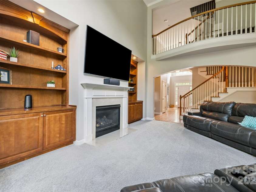 9142 Drayton Lane, Indian Land, SC 29707.  MLS# CAR4275785, YatesRealty ID 417. Family room has gas fireplace and is surrounded by built-ins.