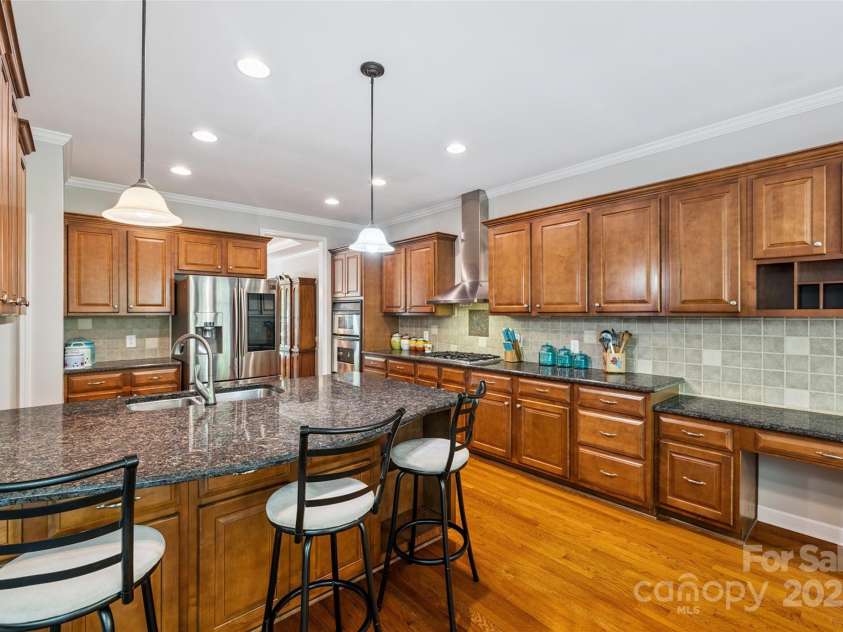 9142 Drayton Lane, Indian Land, SC 29707.  MLS# CAR4275785, YatesRealty ID 417. There are plenty of cabinets and counter space in this huge kitchen with a peninsula that also offers space for additional seating