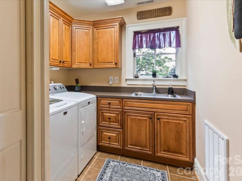 6 Jasmine Lane, Brevard, NC 28712.  MLS# CAR4410502, YatesRealty ID 41700. Laundry Room off Kitchen
