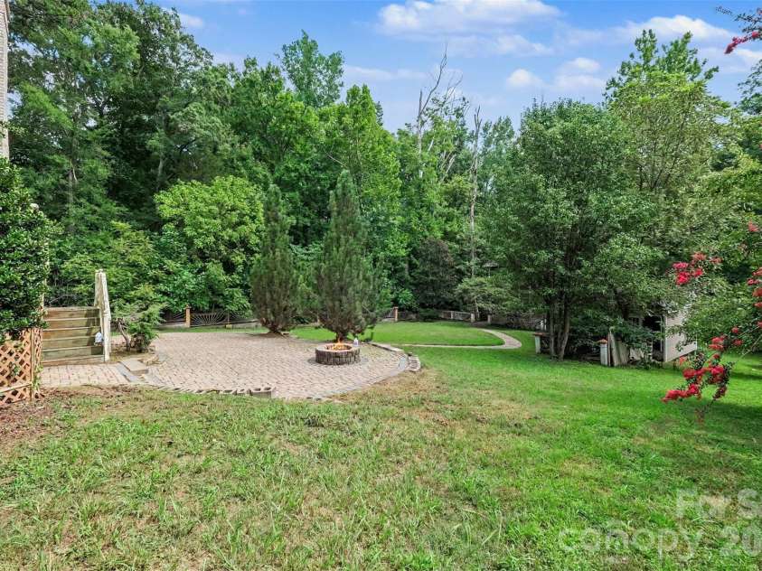 13631 William Stowe Drive, Charlotte, NC 28262.  MLS# CAR4411890, YatesRealty ID 41701. Back Yard with firepit