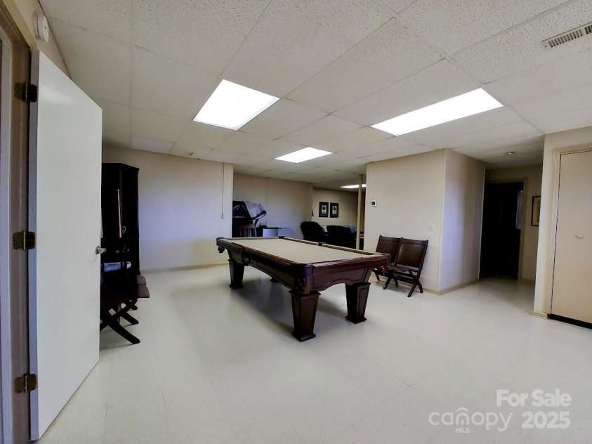 545 Summit Road, Tryon, NC 28782.  MLS# CAR4293286, YatesRealty ID 4171. Downstairs Flex Space