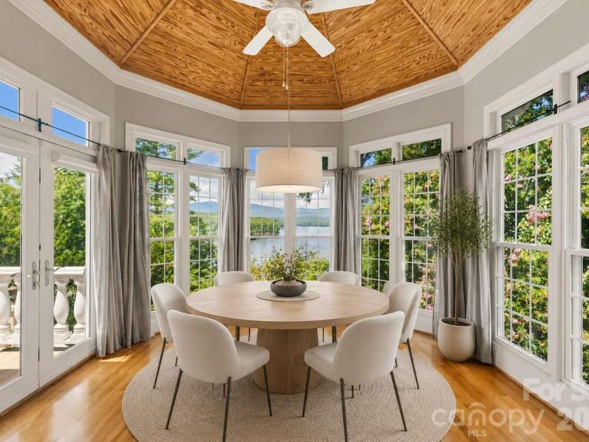 705 Lake Club Drive, Nebo, NC 28761.  MLS# CAR4410301, YatesRealty ID 41710. Virtually staged dining with lake views