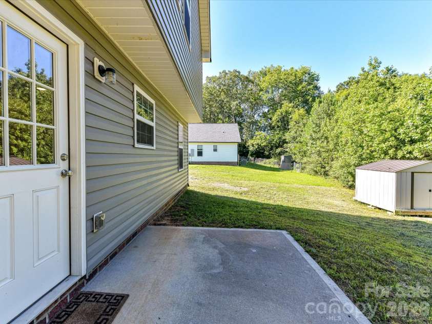 550 Claymon Road, Oakboro, NC 28129.  MLS# CAR4410271, YatesRealty ID 41729. Back Patio