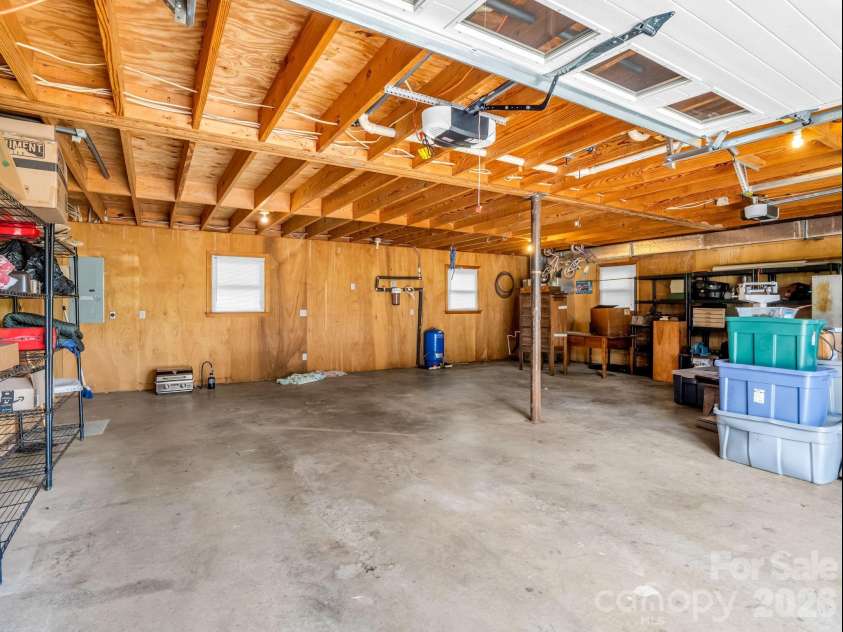90 Mcentire Road, Tryon, NC 28782.  MLS# CAR4411875, YatesRealty ID 41733. 2 car garage