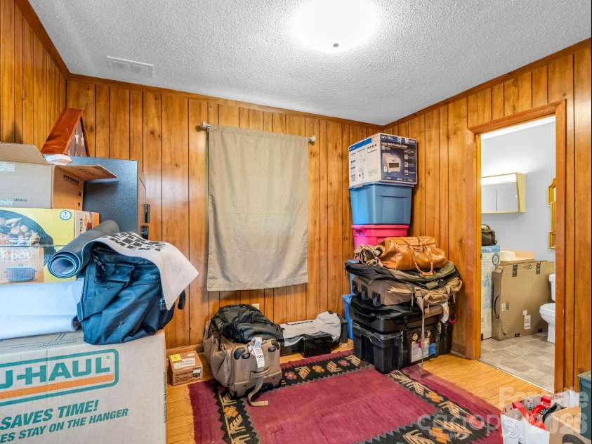 90 Mcentire Road, Tryon, NC 28782.  MLS# CAR4411875, YatesRealty ID 41733. Flex room on main level