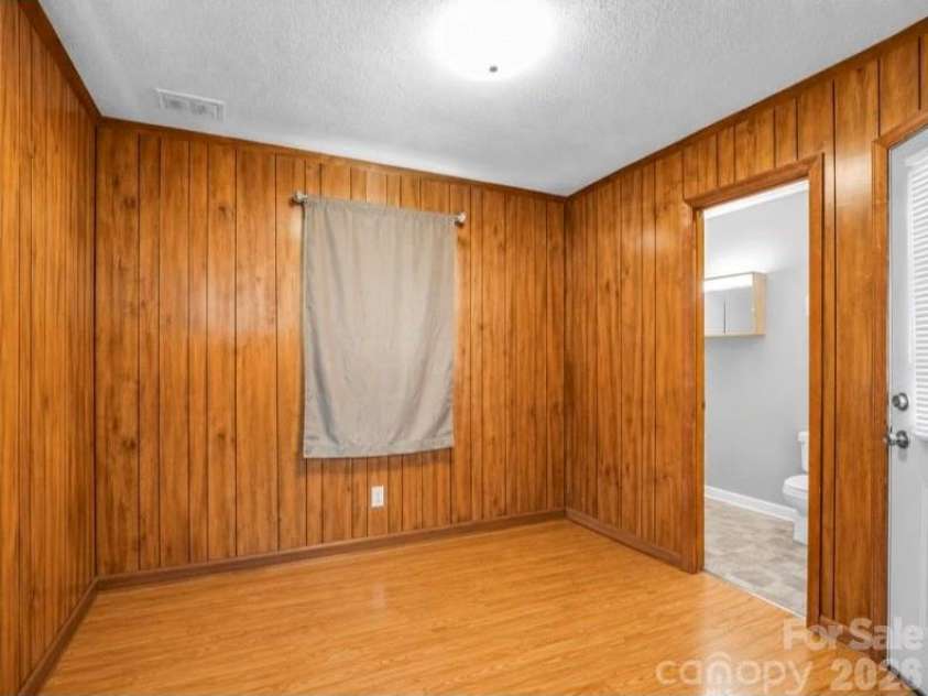 90 Mcentire Road, Tryon, NC 28782.  MLS# CAR4411875, YatesRealty ID 41733. Flex room on main without the tenant