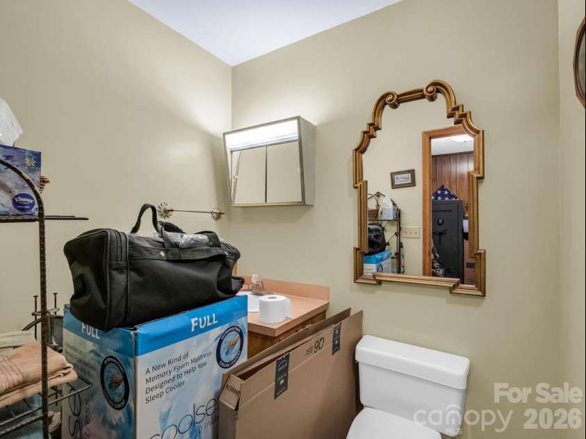 90 Mcentire Road, Tryon, NC 28782.  MLS# CAR4411875, YatesRealty ID 41733. Guest bathroom