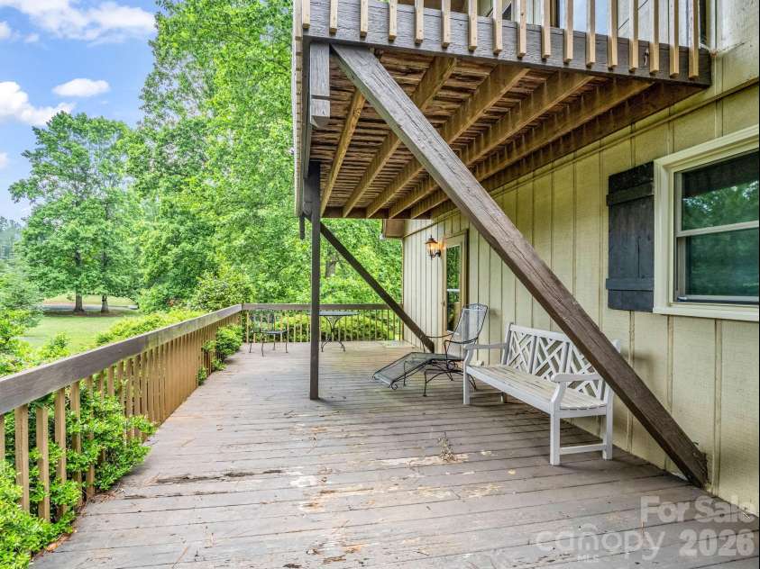 90 Mcentire Road, Tryon, NC 28782.  MLS# CAR4411875, YatesRealty ID 41733. Lower deck