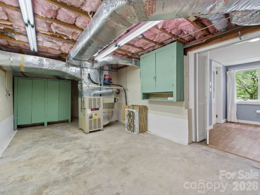 242 Hills Drive, Hendersonville, NC 28791.  MLS# CAR4410562, YatesRealty ID 41745. Basement storage