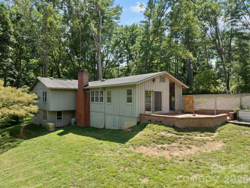 242 Hills Drive, Hendersonville, NC 28791.  MLS# CAR4410562, YatesRealty ID 41745. Side rear view