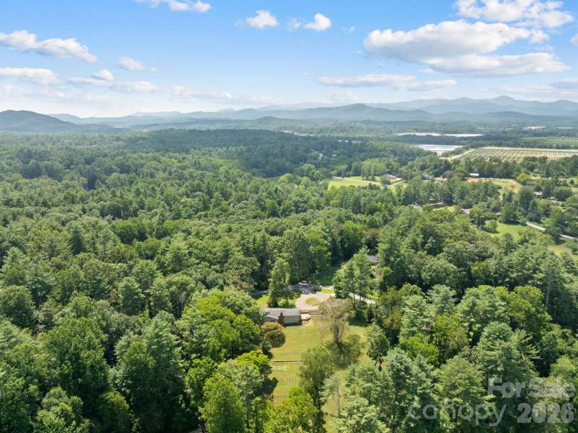 242 Hills Drive, Hendersonville, NC 28791.  MLS# CAR4410562, YatesRealty ID 41745. What a setting!