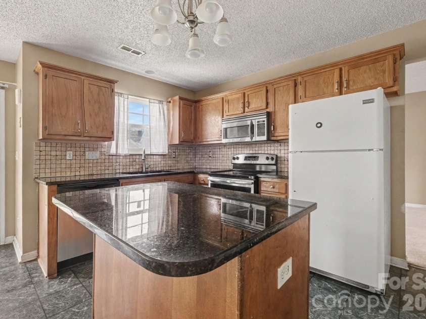 9813 Baxter Caldwell Drive, Charlotte, NC 28213.  MLS# CAR4411650, YatesRealty ID 41769. 