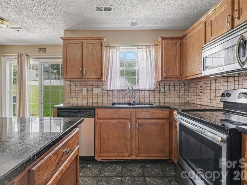 9813 Baxter Caldwell Drive, Charlotte, NC 28213.  MLS# CAR4411650, YatesRealty ID 41769. 