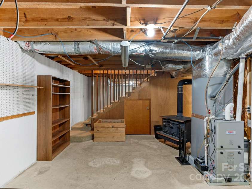 2036 Biggers Lake Road, Shelby, NC 28152.  MLS# CAR4273982, YatesRealty ID 4178. Basement - wood stove