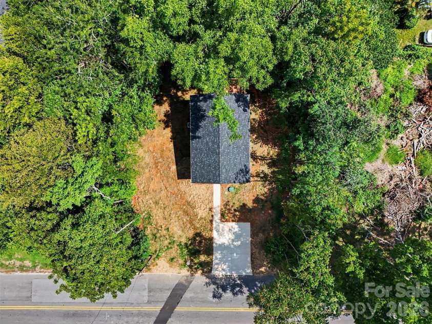155 Corban Avenue, Concord, NC 28025.  MLS# CAR4405826, YatesRealty ID 41785. Nestled in the trees!