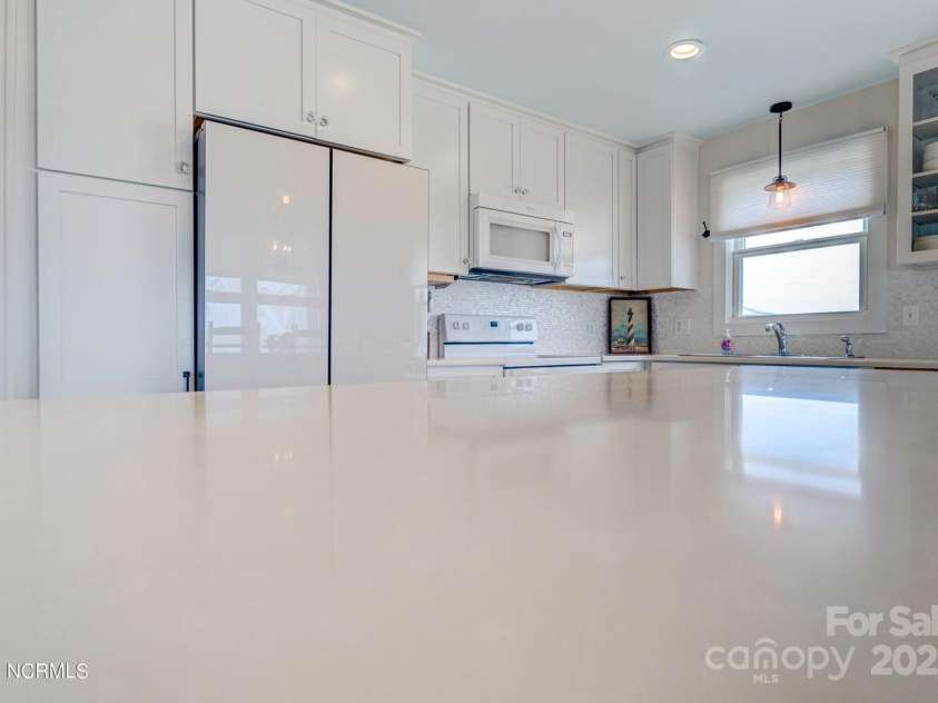 309 Beach Drive, Oak Island, NC 28465.  MLS# CAR4243105, YatesRealty ID 4179. 