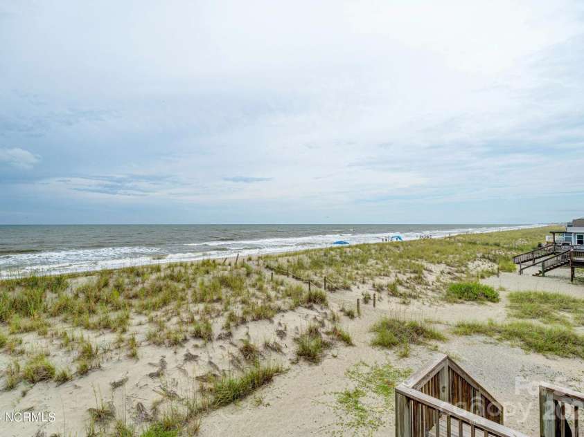 309 Beach Drive, Oak Island, NC 28465.  MLS# CAR4243105, YatesRealty ID 4179. 