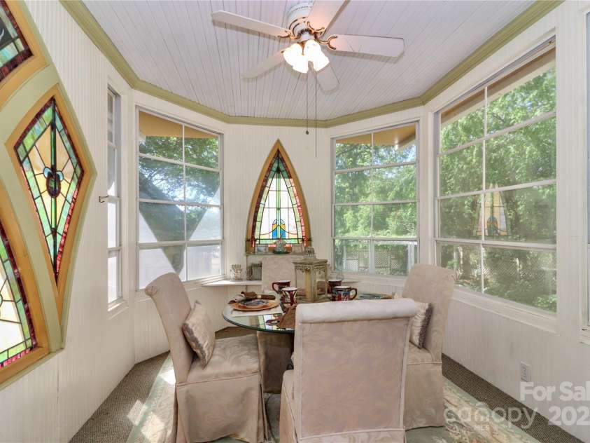 235 Walnut Street, Statesville, NC 28677.  MLS# CAR4134450, YatesRealty ID 418. Atrium just off the deck with stunning stain glass windows.