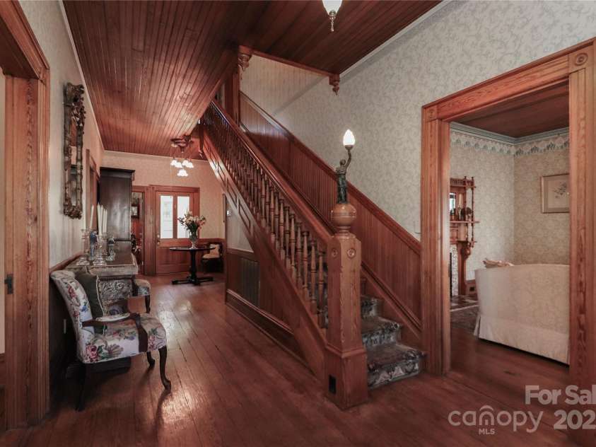 235 Walnut Street, Statesville, NC 28677.  MLS# CAR4134450, YatesRealty ID 418. Entry Hall - Original to the house Newel Post Lamp on Staircase