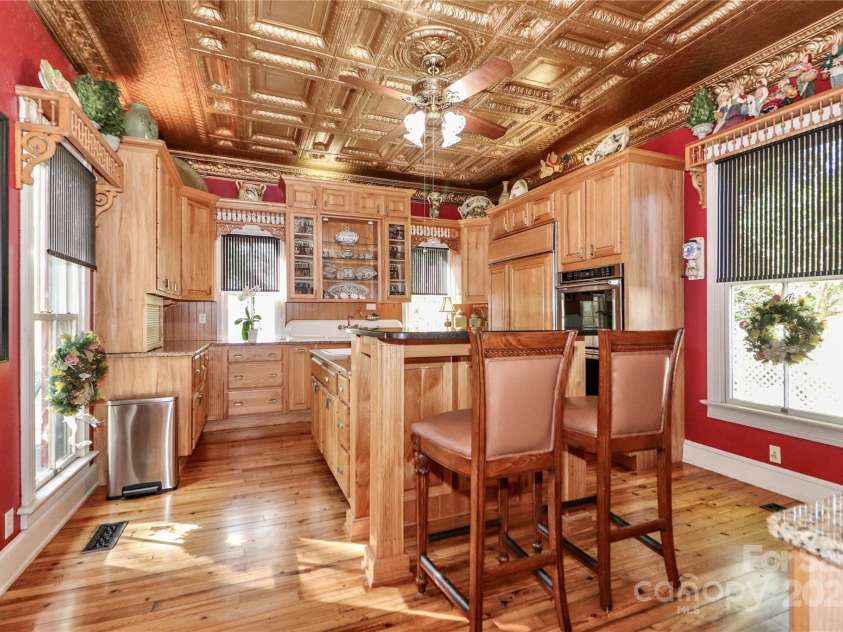 235 Walnut Street, Statesville, NC 28677.  MLS# CAR4134450, YatesRealty ID 418. Kitchen - Stamped Tin Ceiling, Solid Surface Countertops, Island with Prep Sink & Gas Stove Top
