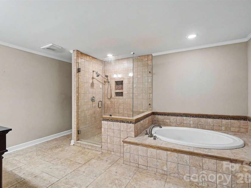 502 Cedarwood Drive, Monroe, NC 28112.  MLS# CAR4405782, YatesRealty ID 41817. Spacious Primary Bathroom
