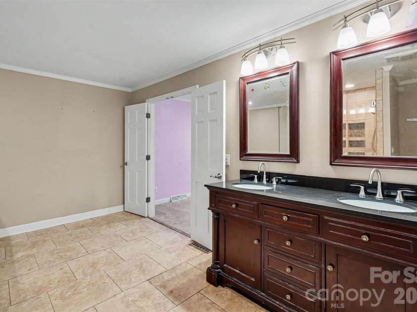 502 Cedarwood Drive, Monroe, NC 28112.  MLS# CAR4405782, YatesRealty ID 41817. Spacious Primary Bathroom
