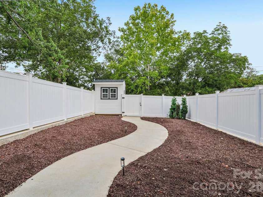 105 Maple Street, Badin, NC 28009.  MLS# CAR4409947, YatesRealty ID 41821. Backyard