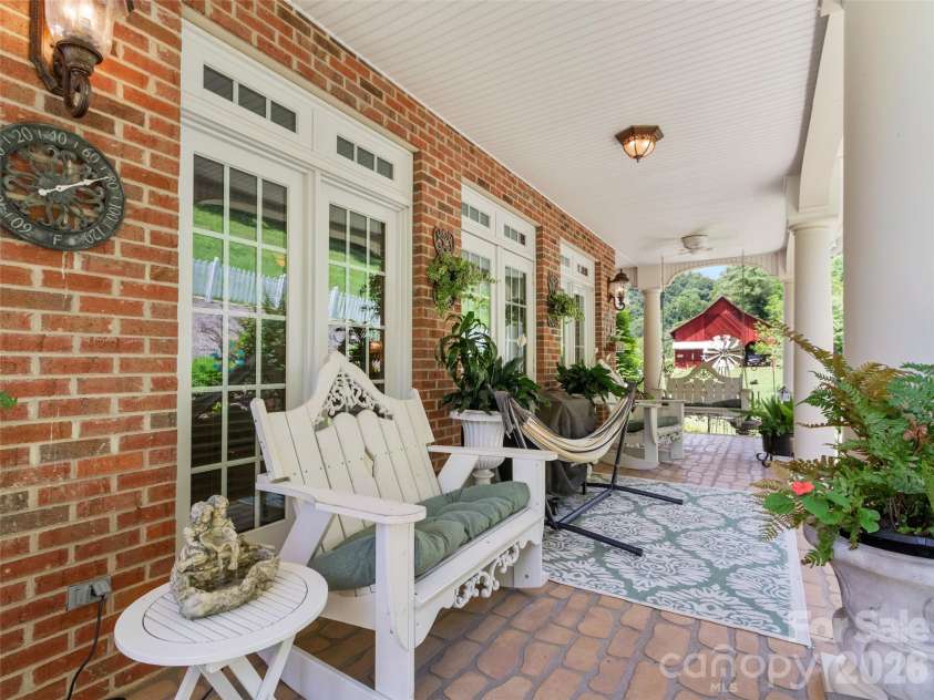 38 Peterson Lane, Green Mountain, NC 28740.  MLS# CAR4405533, YatesRealty ID 41828. Covered back porch
