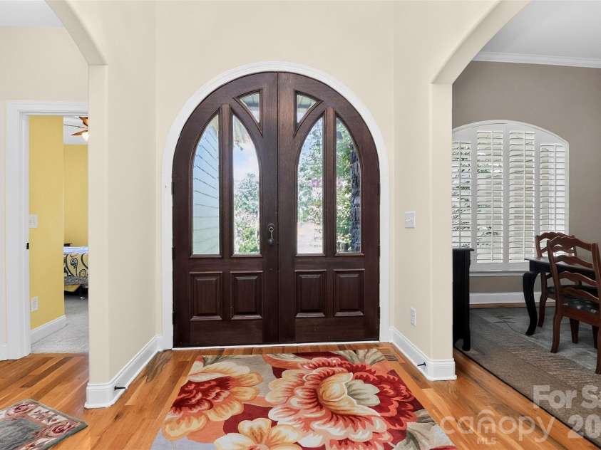 154 Ramano Drive, Iron Station, NC 28080.  MLS# CAR4411067, YatesRealty ID 41853. Beautiful solid wood double arched front door